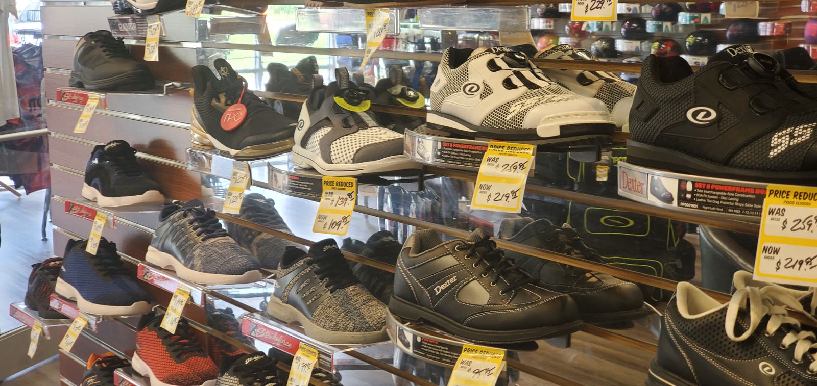 A wall of bowling shoes with sale tags